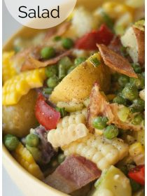 close up of potato salad with fingerling potatoes, bacon, corn, and peas