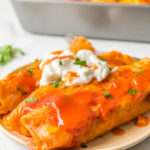 2 enchiladas on a plate