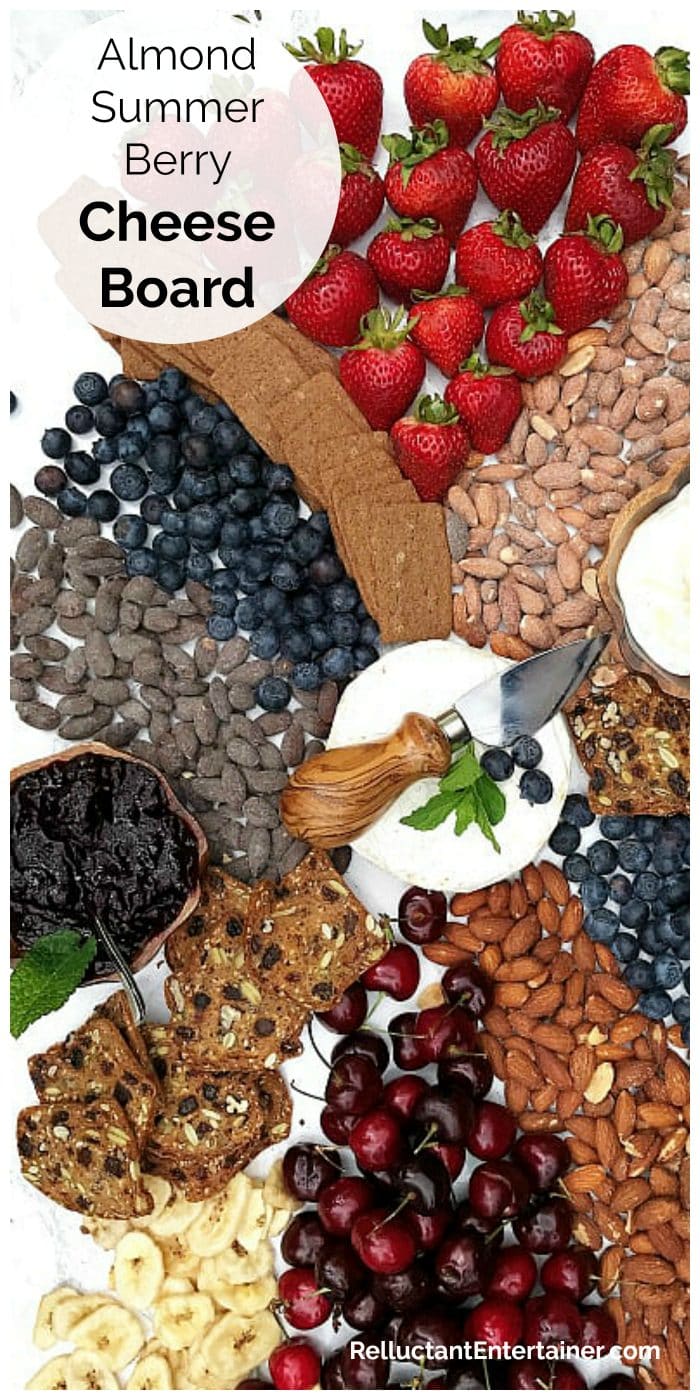 red, white, and blue cheese board with berries and almonds