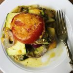 white plate with a serving of summer squash casserole