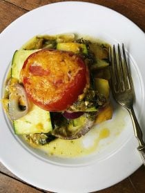 white plate with a serving of summer squash casserole