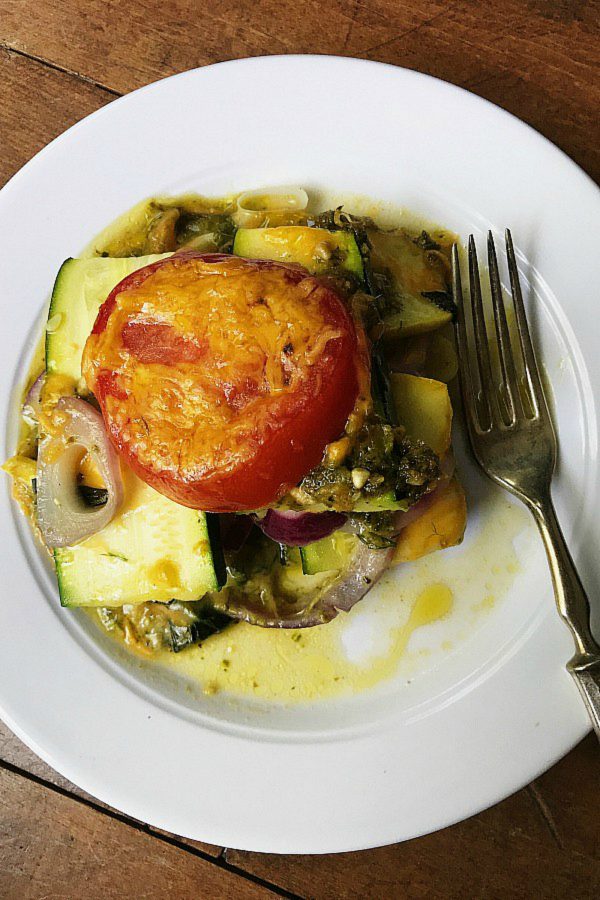 white plate with a serving of summer squash casserole