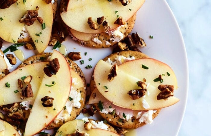 apple sliced bite with nuts and cheese