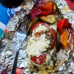foil pack dinner of caprese chicken wrapped in foil