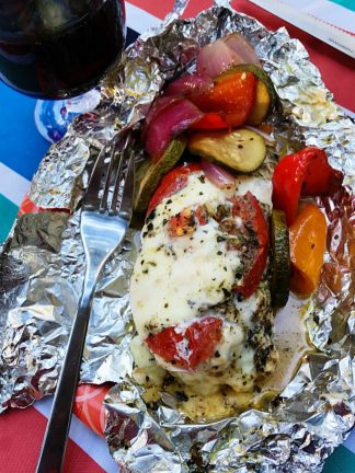 foil pack dinner of caprese chicken wrapped in foil