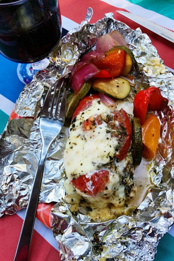 foil pack dinner of caprese chicken wrapped in foil