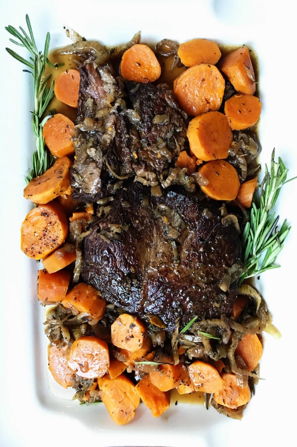 Rectangle white plate with Slow Cooker Sweet Potato Roast Beef Dinner