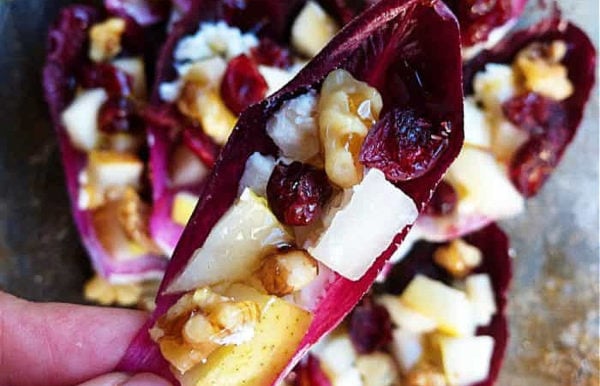 chopped pears and dried cranberries in endive