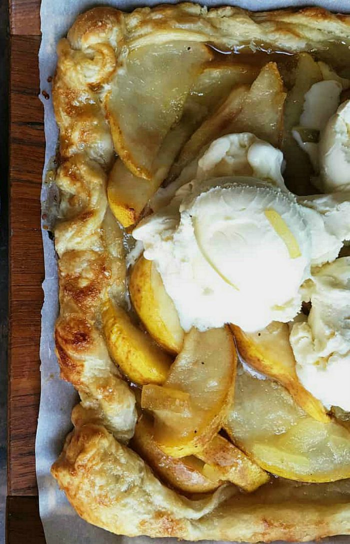 golden puff pastry dessert with pears and ice cream