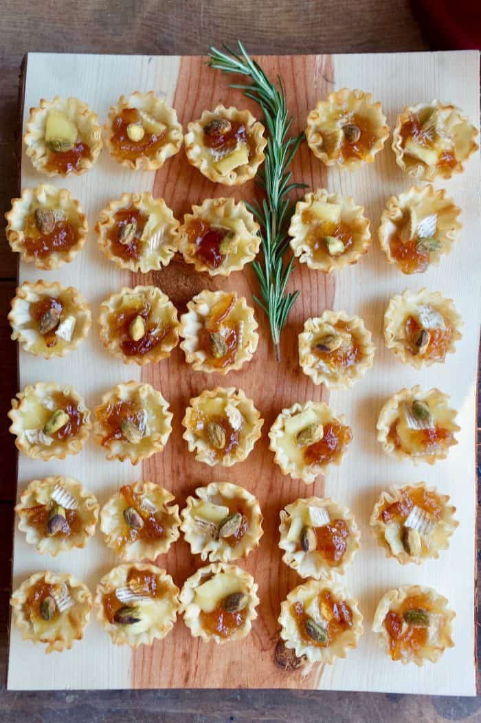 Marmalade Pistachio Brie Mini Tartlets on wood tray