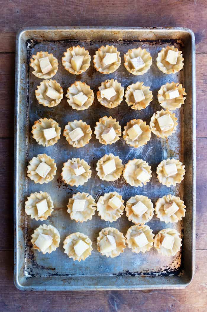 cookie sheet of Marmalade Pistachio Brie Mini Tartlets