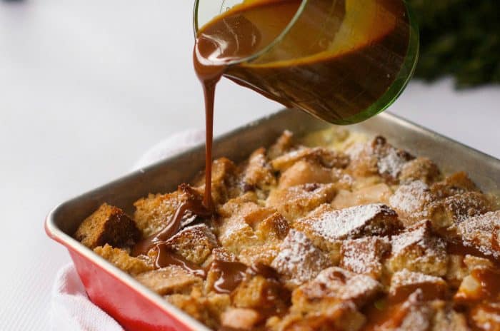 pouring caramel sauce over Pear Bread Pudding 