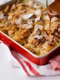 pouring caramel on Pear Bread Pudding