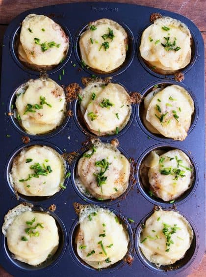 muffin tin of coooked Potato Gratin Muffin Stacks