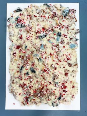slab of White Chocolate Peppermint Bark on a white plate