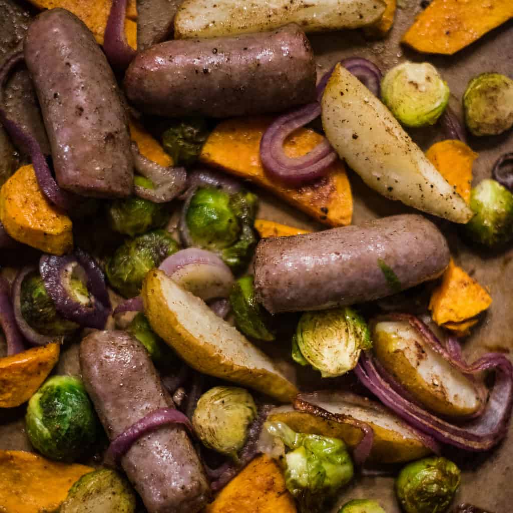 https://reluctantentertainer.com/wp-content/uploads/2018/01/Brussels-Sprout-Pear-Bratwurst-Sheet-Pan-Dinner-4.jpg