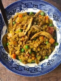 Chicken Curry Crock Pot Lentil Soup in a blue soup bowl