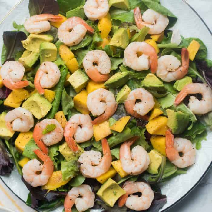 Prawns Mango Avocado Salad on round plate