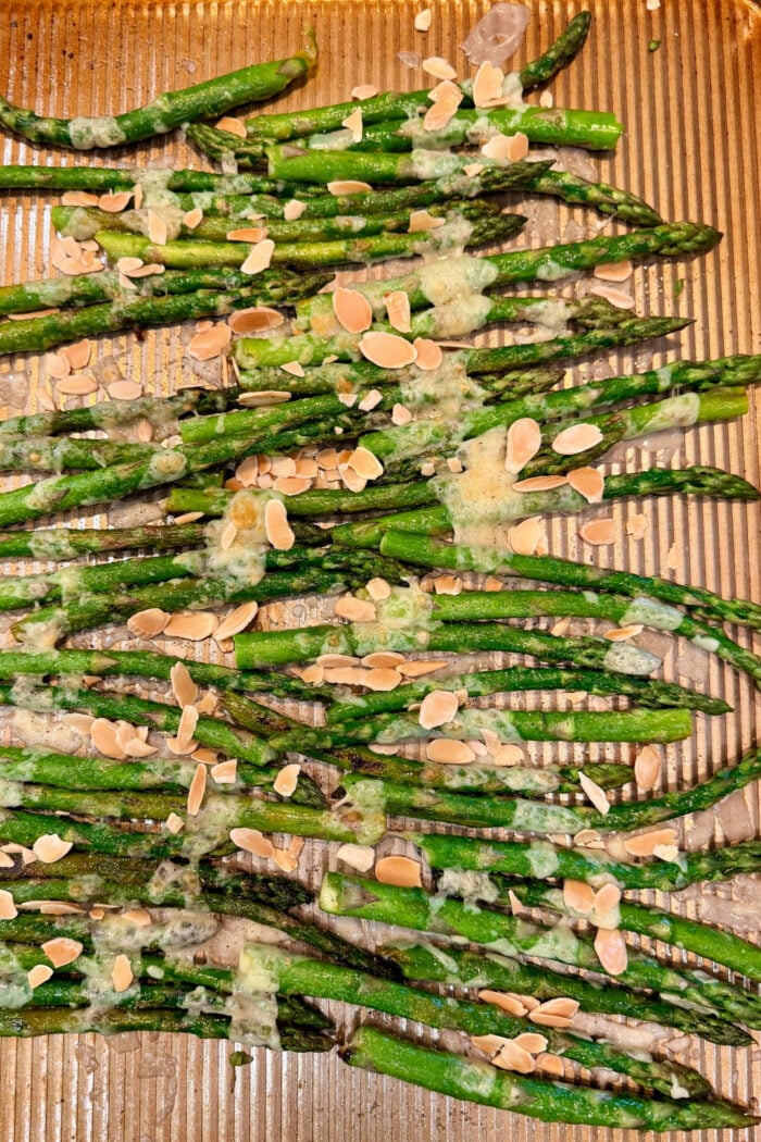 hot melted Parmesa cheese on baked asparagus