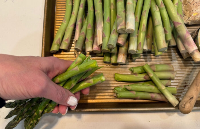 breaking off the woody part of asparagus