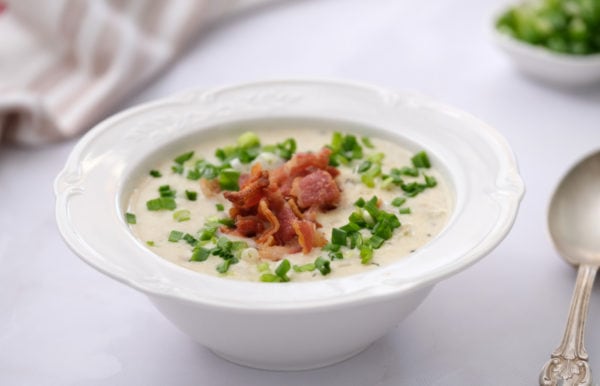white bowl of best clam chowder with bacon