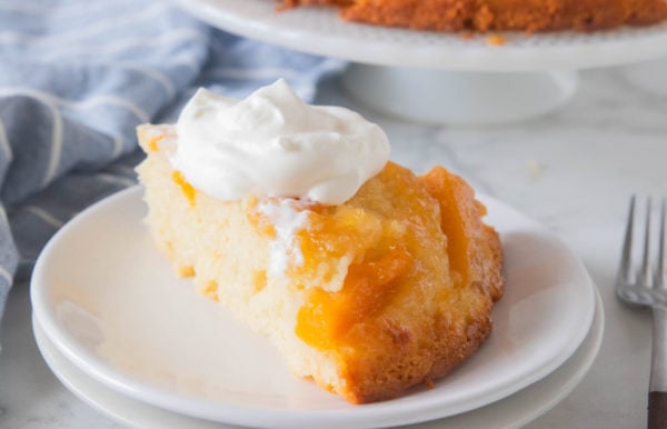 peach cake slice with whipped cream