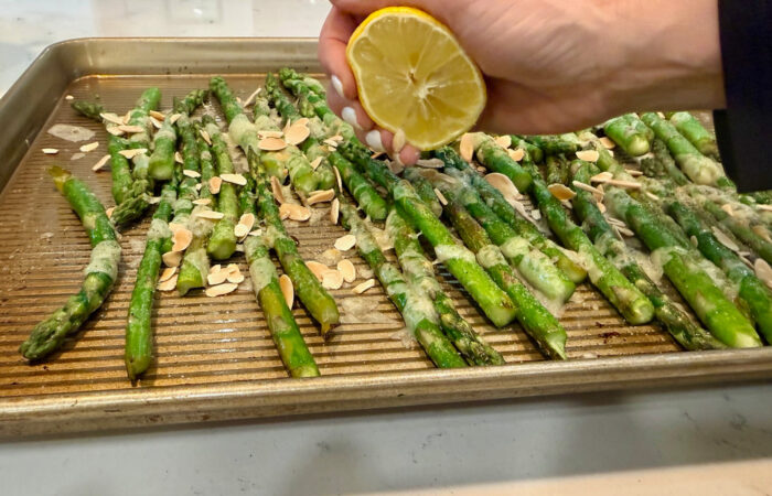 adding lemon squeezed on asparagus side dish