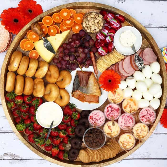 Cheese Board with salmon, boiled eggs, mini bagels, and more