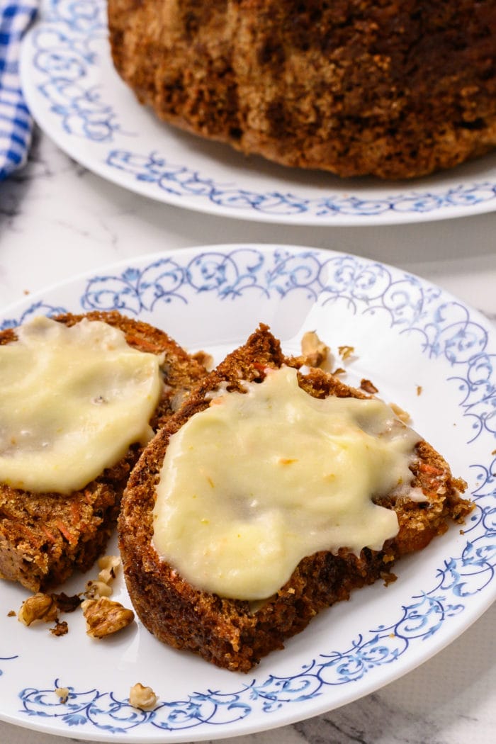 deconstructed cream cheese frosting on a slice of carrot cake