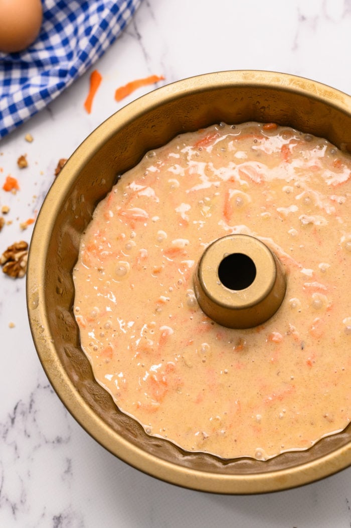 carrot cake batter in a bundt pan