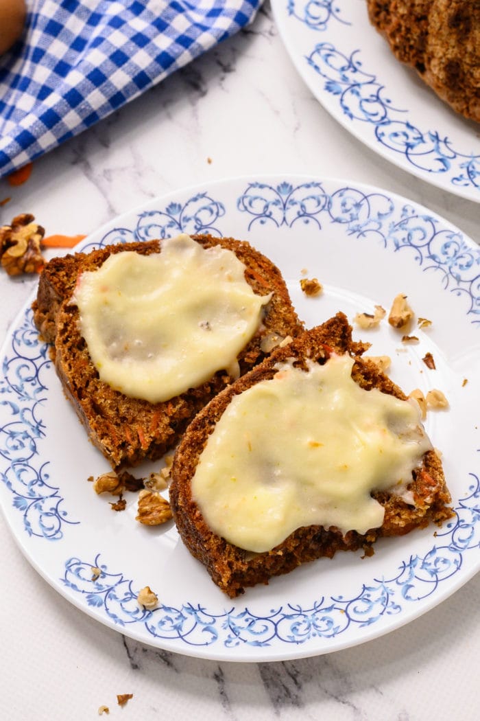 2 pieces of carrot cake with frosting