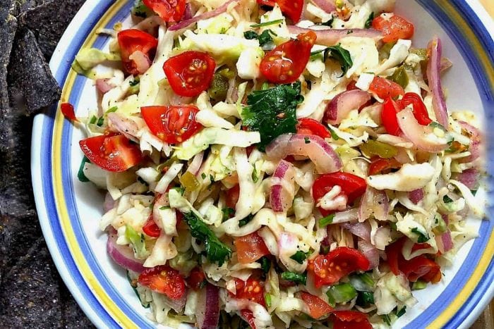 mexican bowl of mexican slaw dip with fresh tomatoes