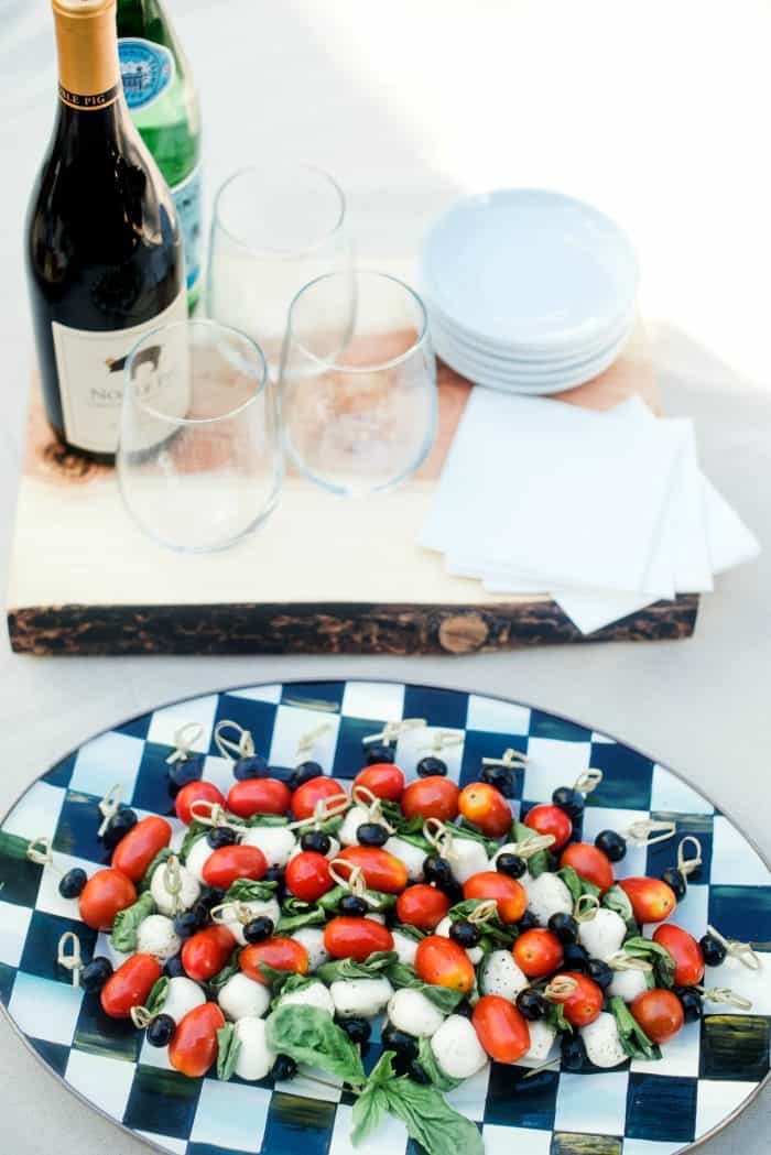 Festive 4th of July Blueberry Caprese Skewers on plate