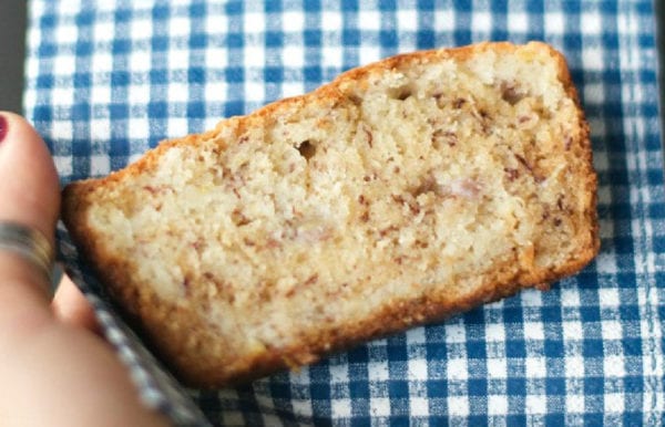 slice of sour cream banana bread on checkered napkin