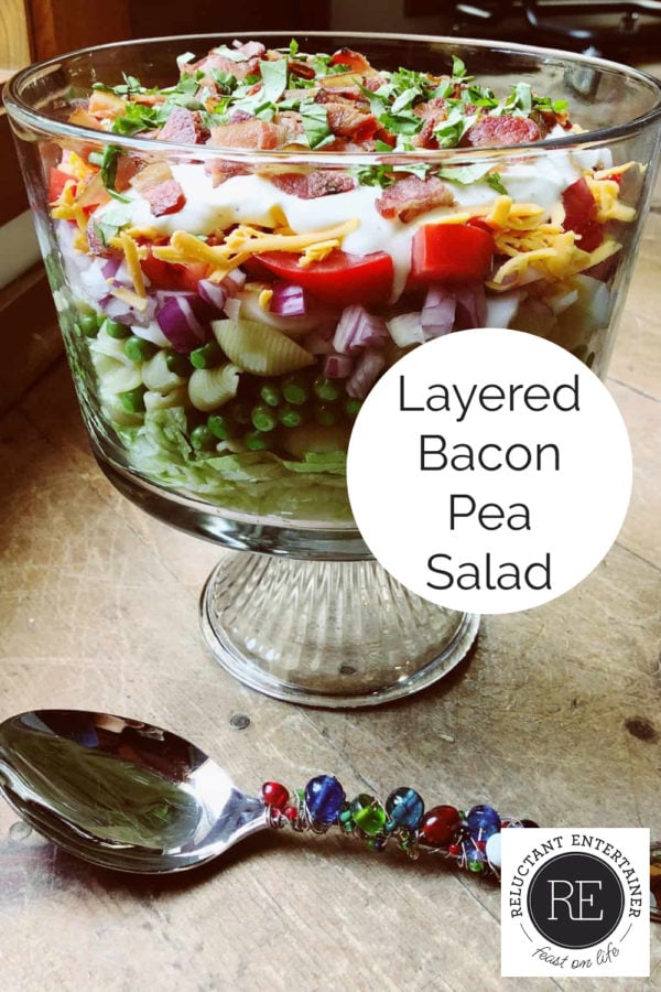 layered bacon pea salad in glass bowl