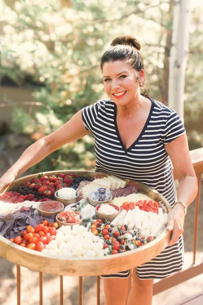 woman holding a Patriotic Epic July 4th Charcuterie Board