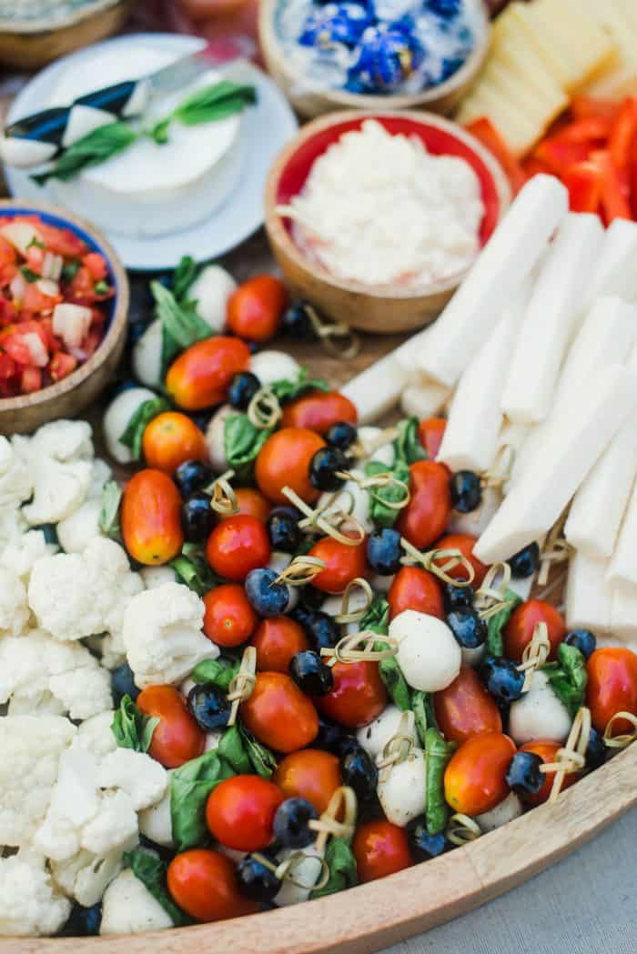 Bueberry Caprese Bites on patriotic cheese board