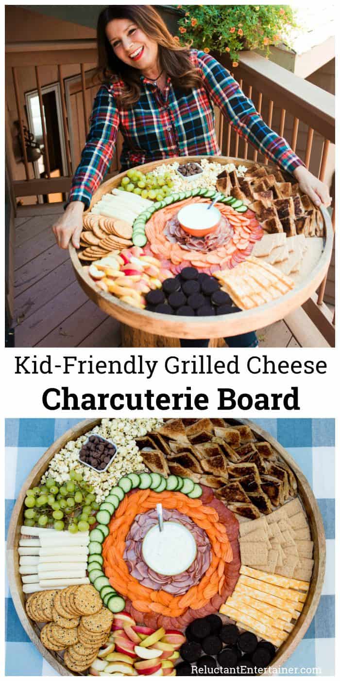 Holding a large wood board with grilled cheese and various snacks for kids