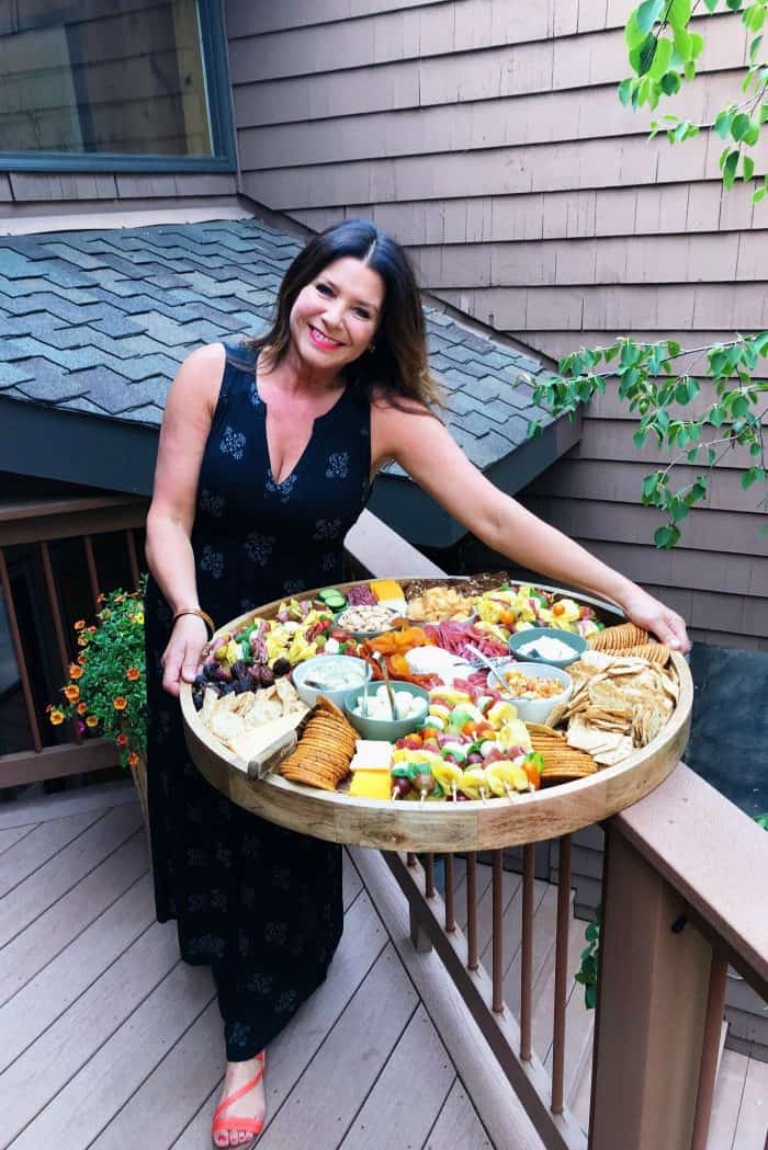 woman holding a Mini Tortellini Kebabs Charcuterie Board