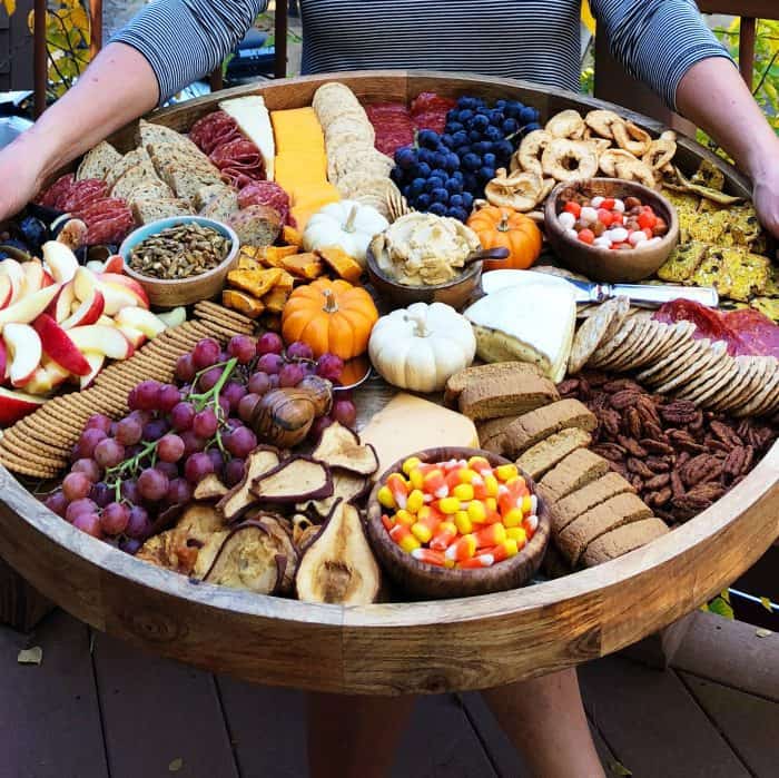 Tasty Fall Epic Charcuterie Board with grapes, crackers meat, cheese