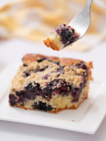 taking a bite of blueberry buckle