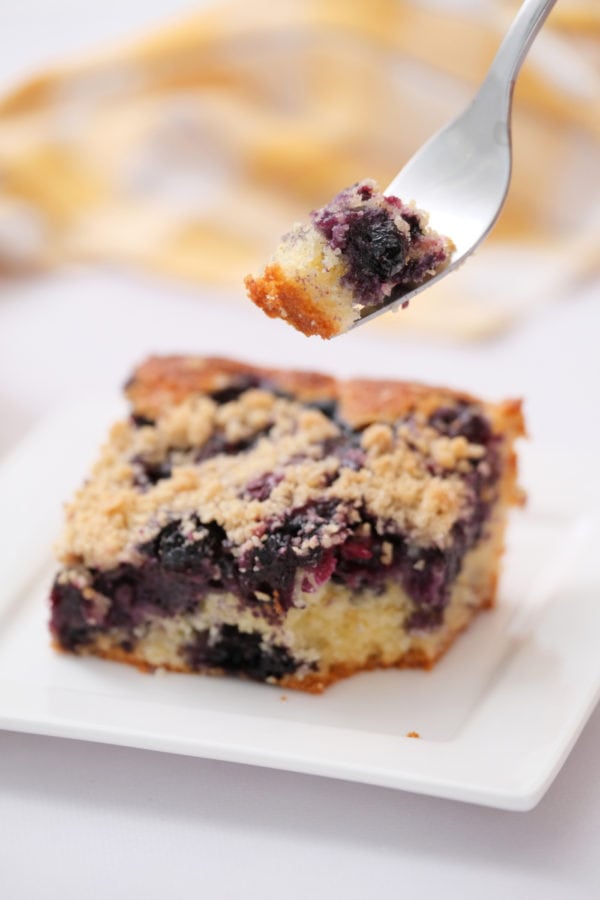 taking a bite of blueberry buckle