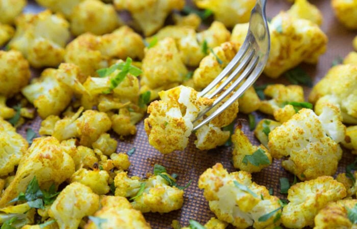 a bite of Roasted Cauliflower with Turmeric