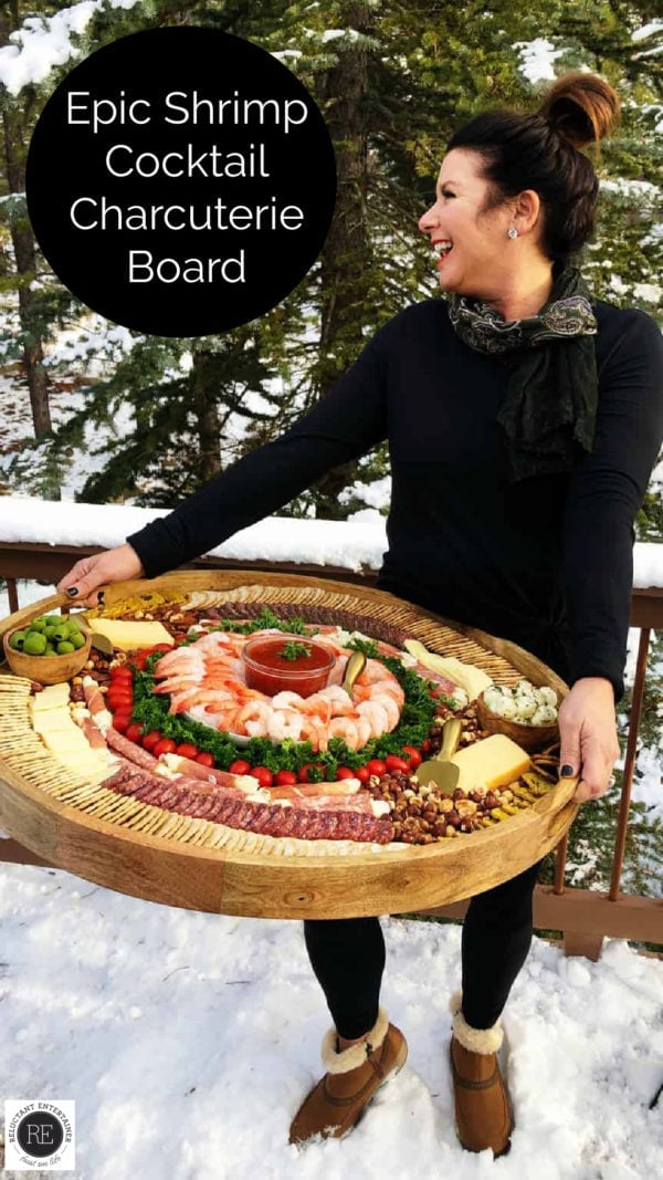 woman holding Epic Shrimp Cocktail Charcuterie Board