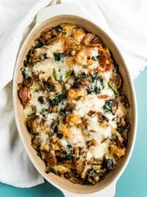 oval pan of cheesy mushroom bread pudding