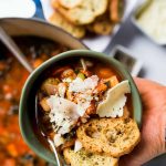 bowl of white bean soup with Parmesan cheese on top