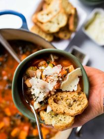 bowl of white bean soup with Parmesan cheese on top