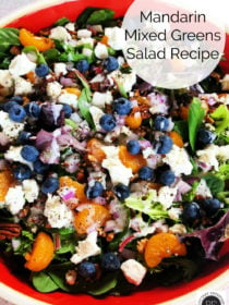 orange bowl of Mandarin Mixed Greens Salad Recipe