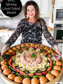 woman holding an epic shrimp salad board