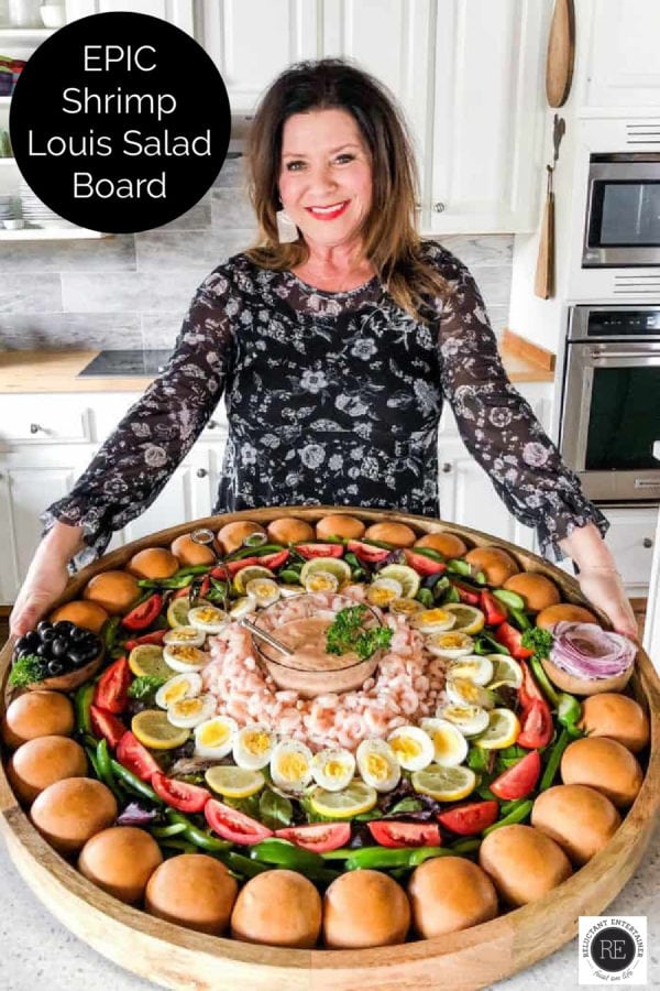 woman holding an epic shrimp salad board